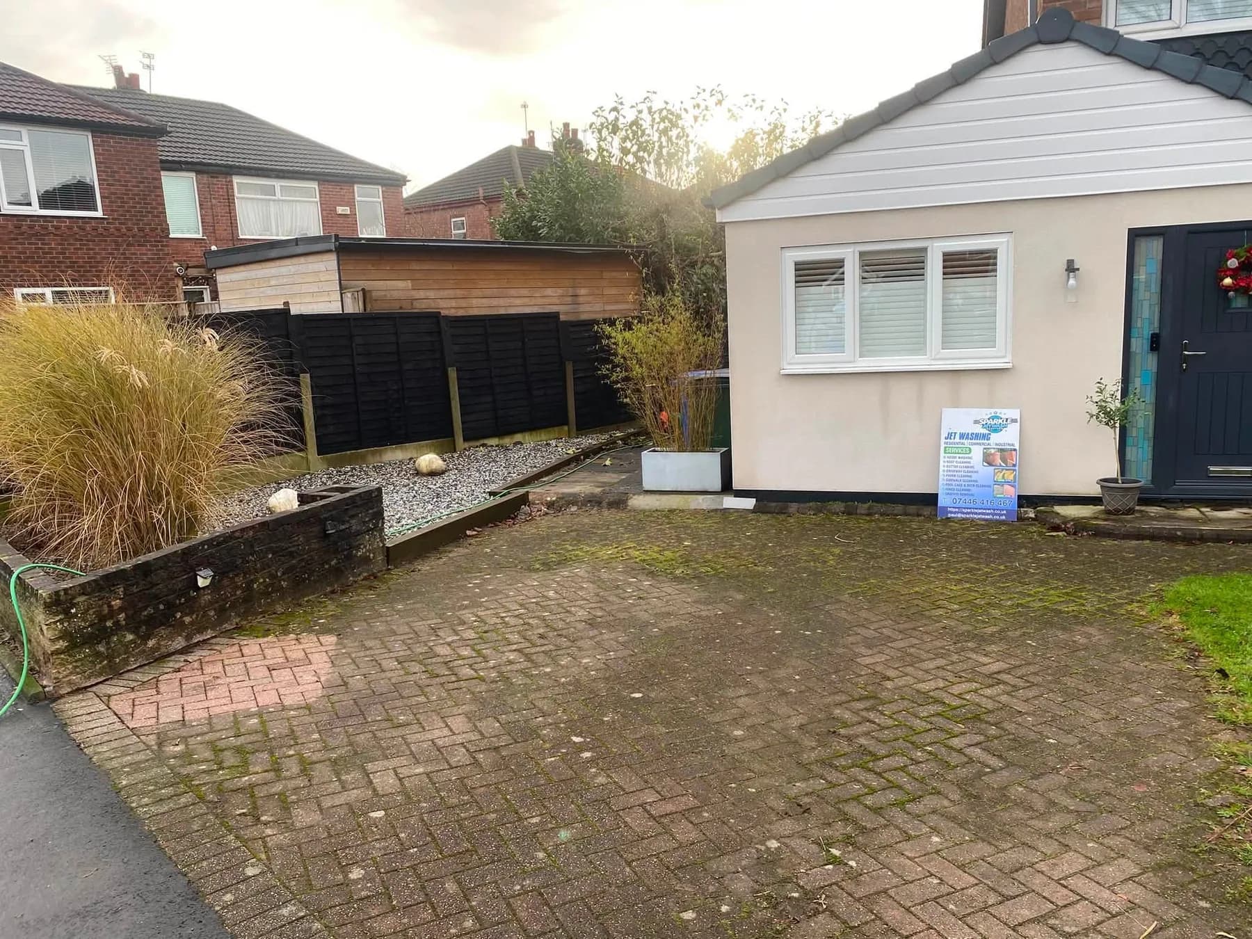 Darkened block paving before exterior cleaning