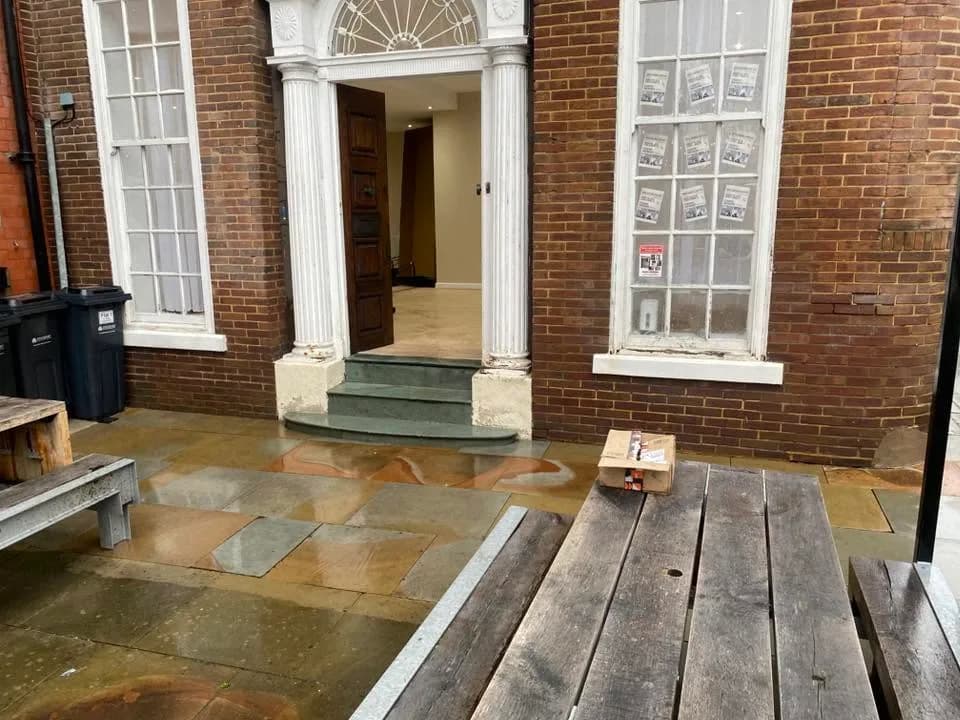 Clean stone walkway at a commercial entrance
