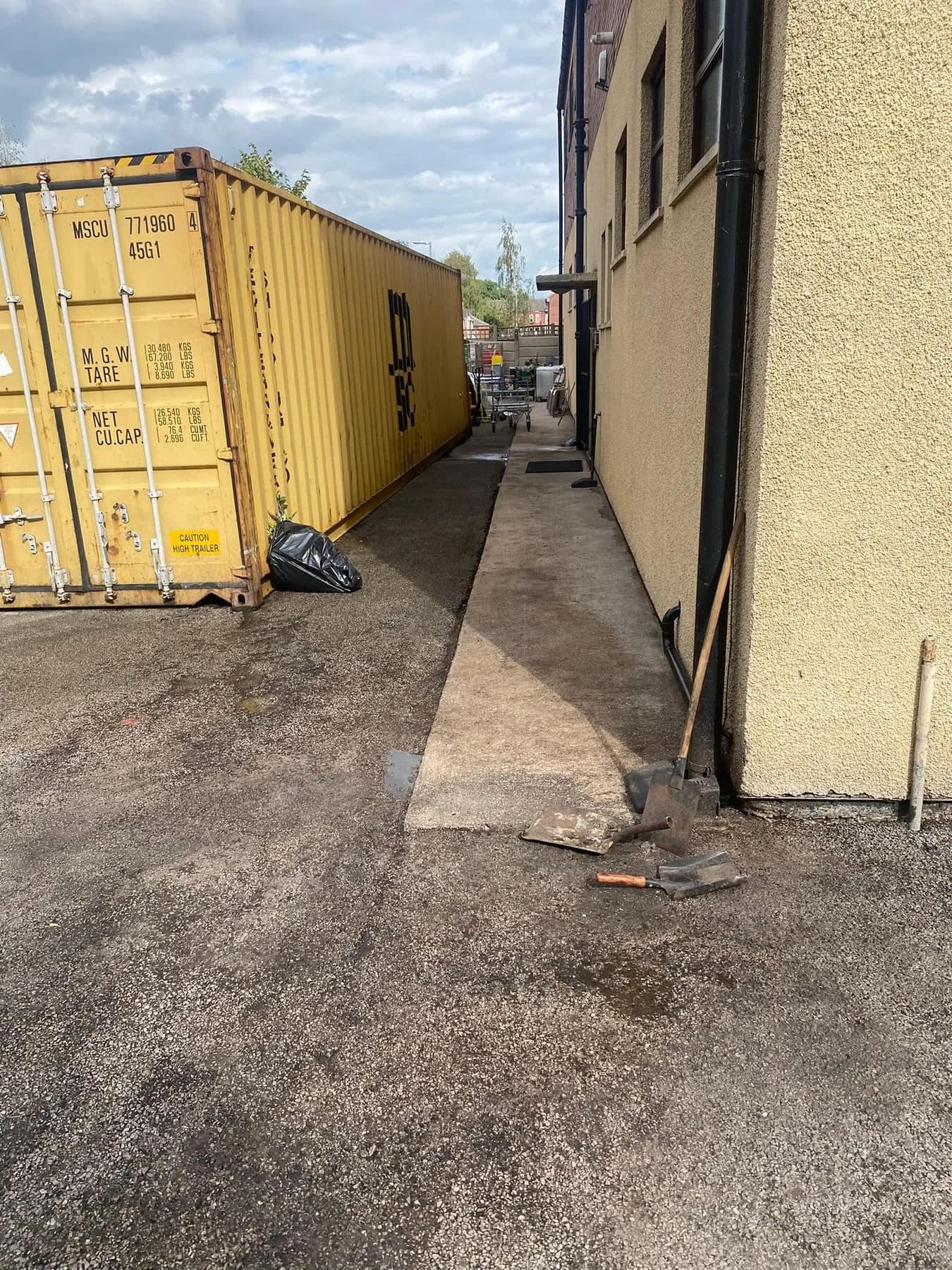 Weathered hardstanding in a commercial service yard