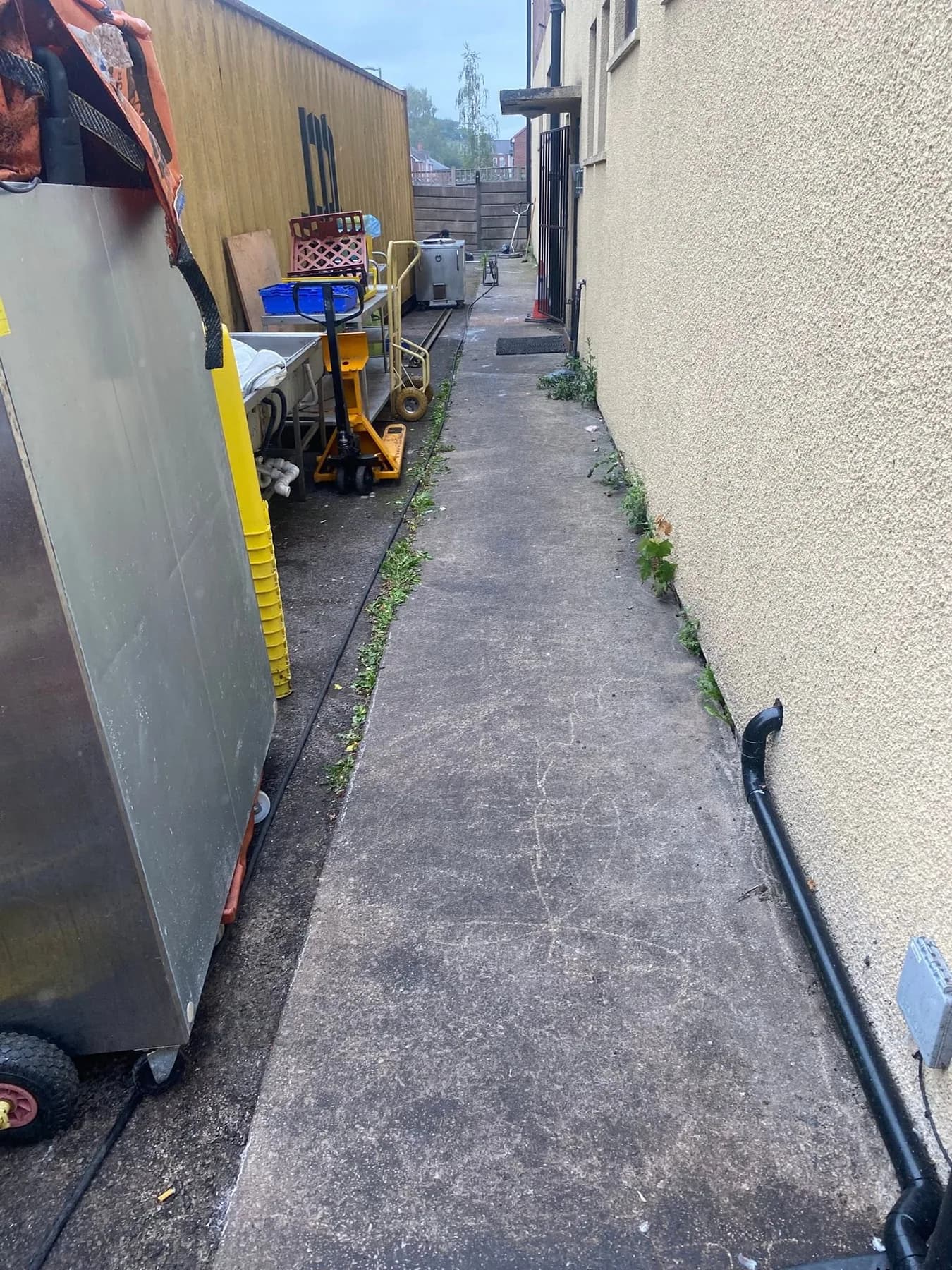 Darkened commercial service-yard hardstanding