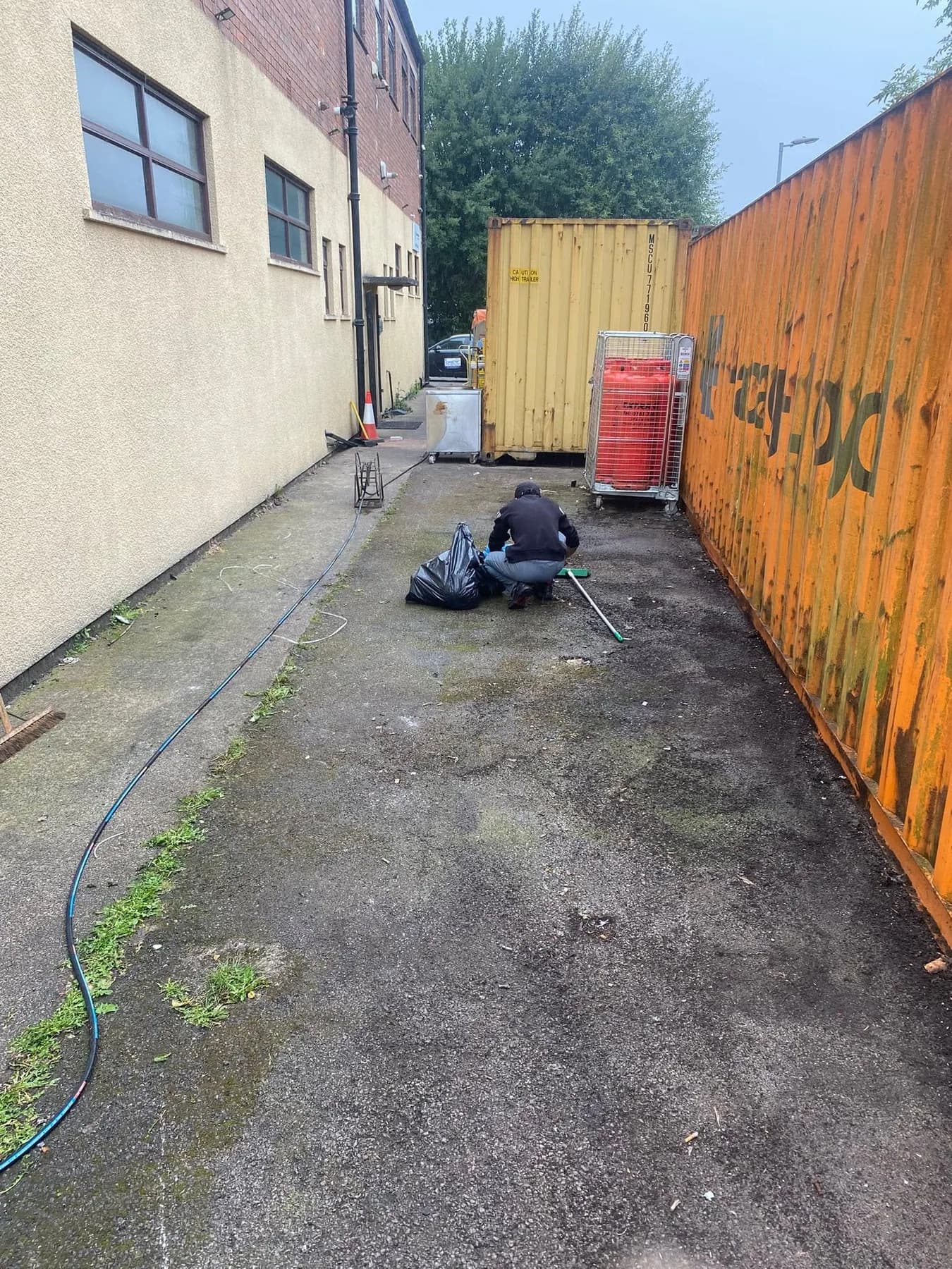 Commercial service-yard cleaning in progress