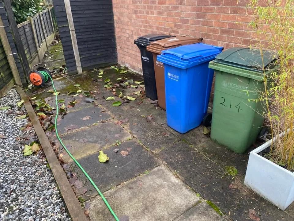 Dark and green marking across patio slabs