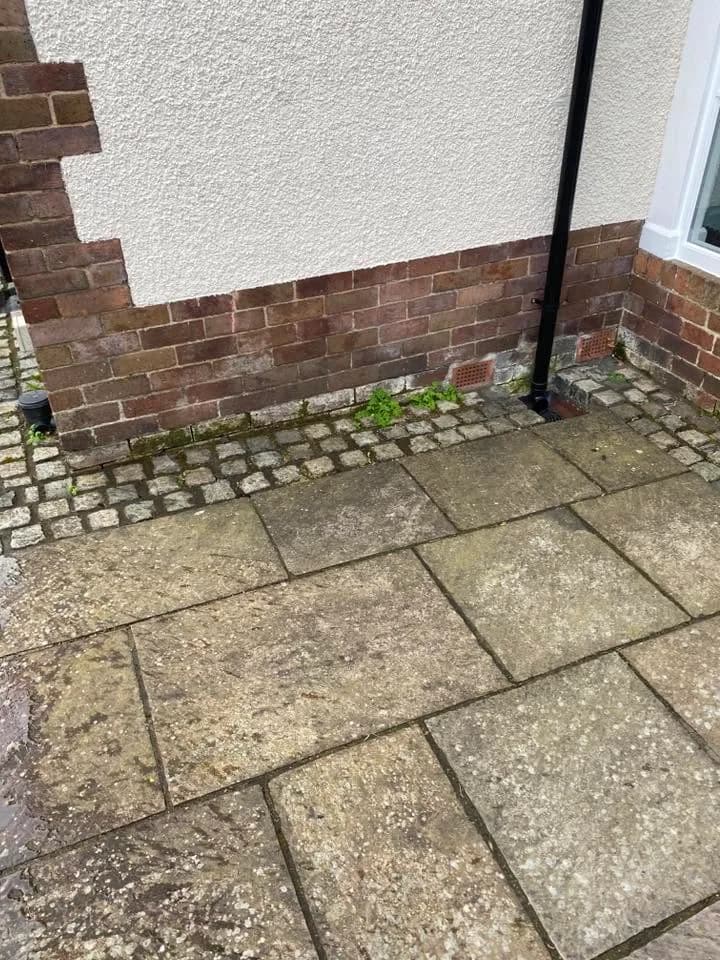 Weathered sandstone slabs and contrasting driveway edge