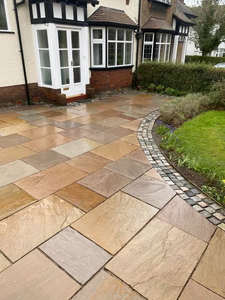 Cleaned sandstone paving at the driveway entrance