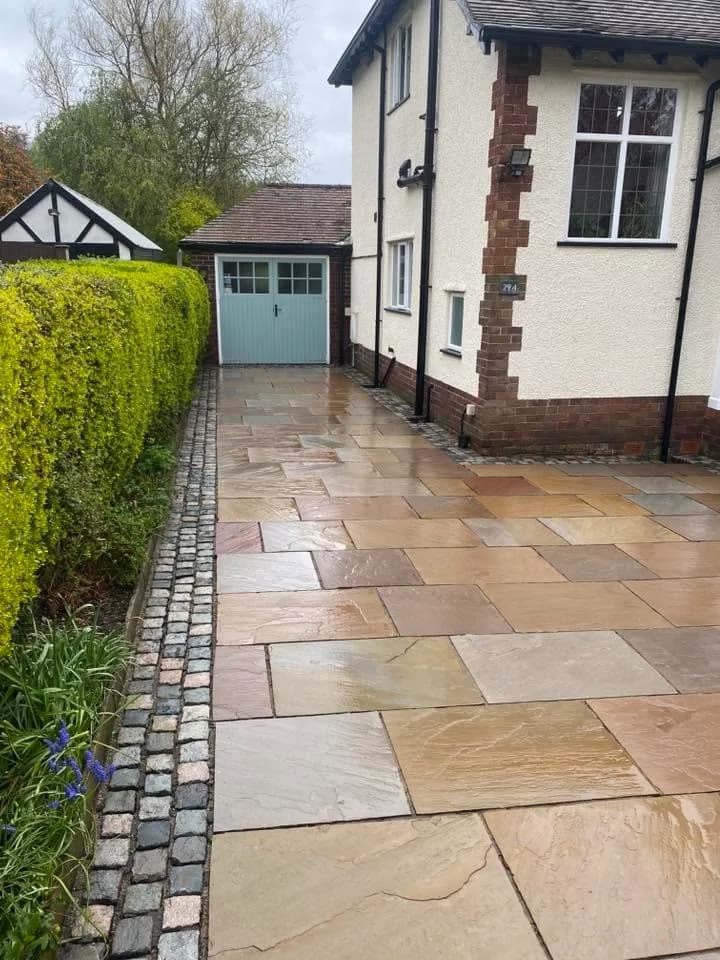 Natural-sandstone driveway after exterior cleaning