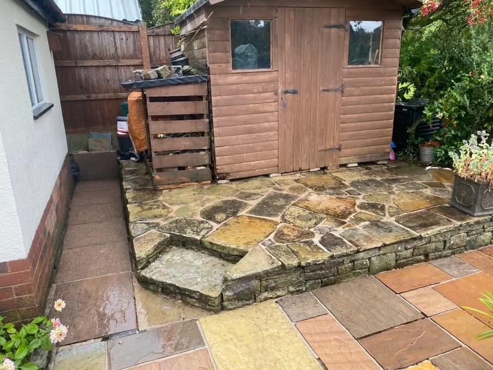Organic build-up along a curved garden-patio edge