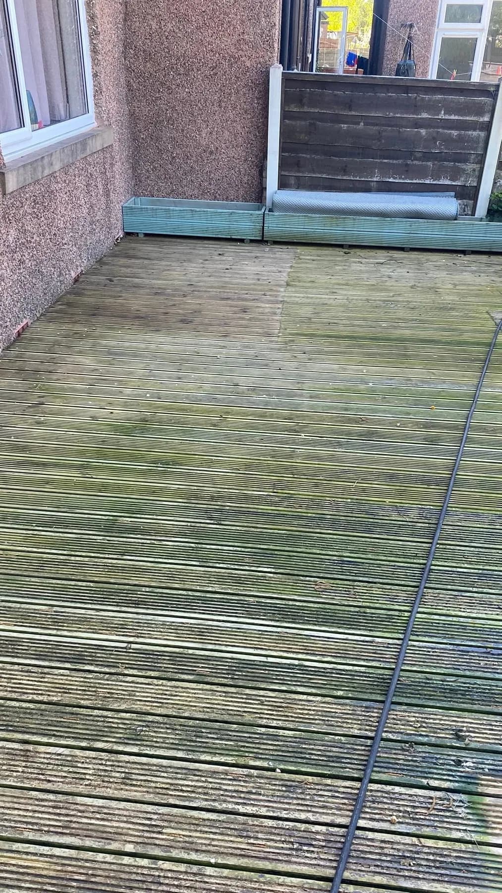 Green organic build-up on grooved deck boards
