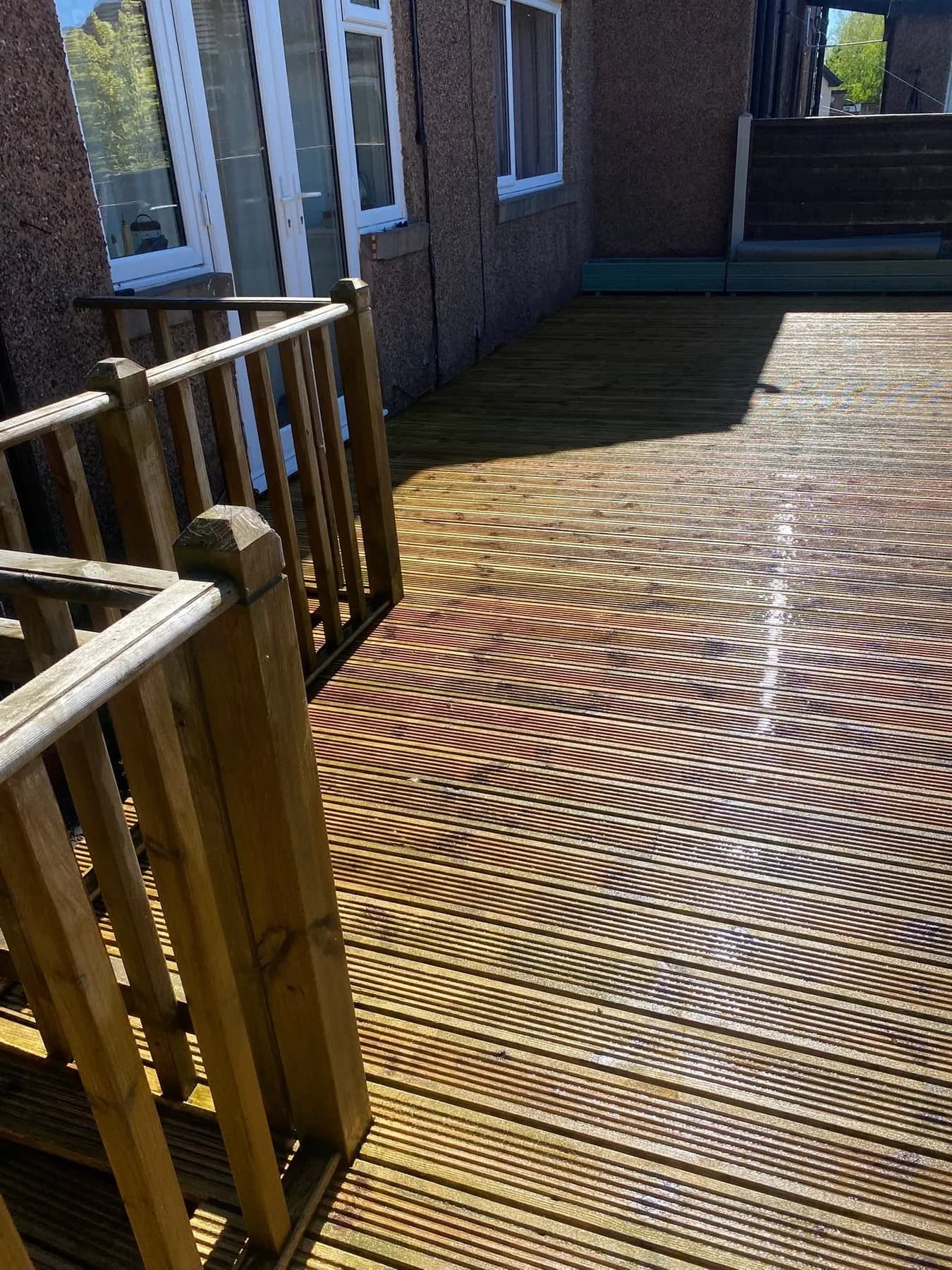 Timber decking being cleaned