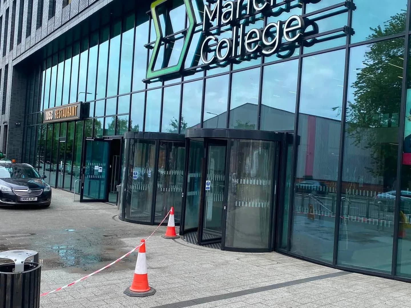 Commercial building with glazed cladding and an entrance canopy